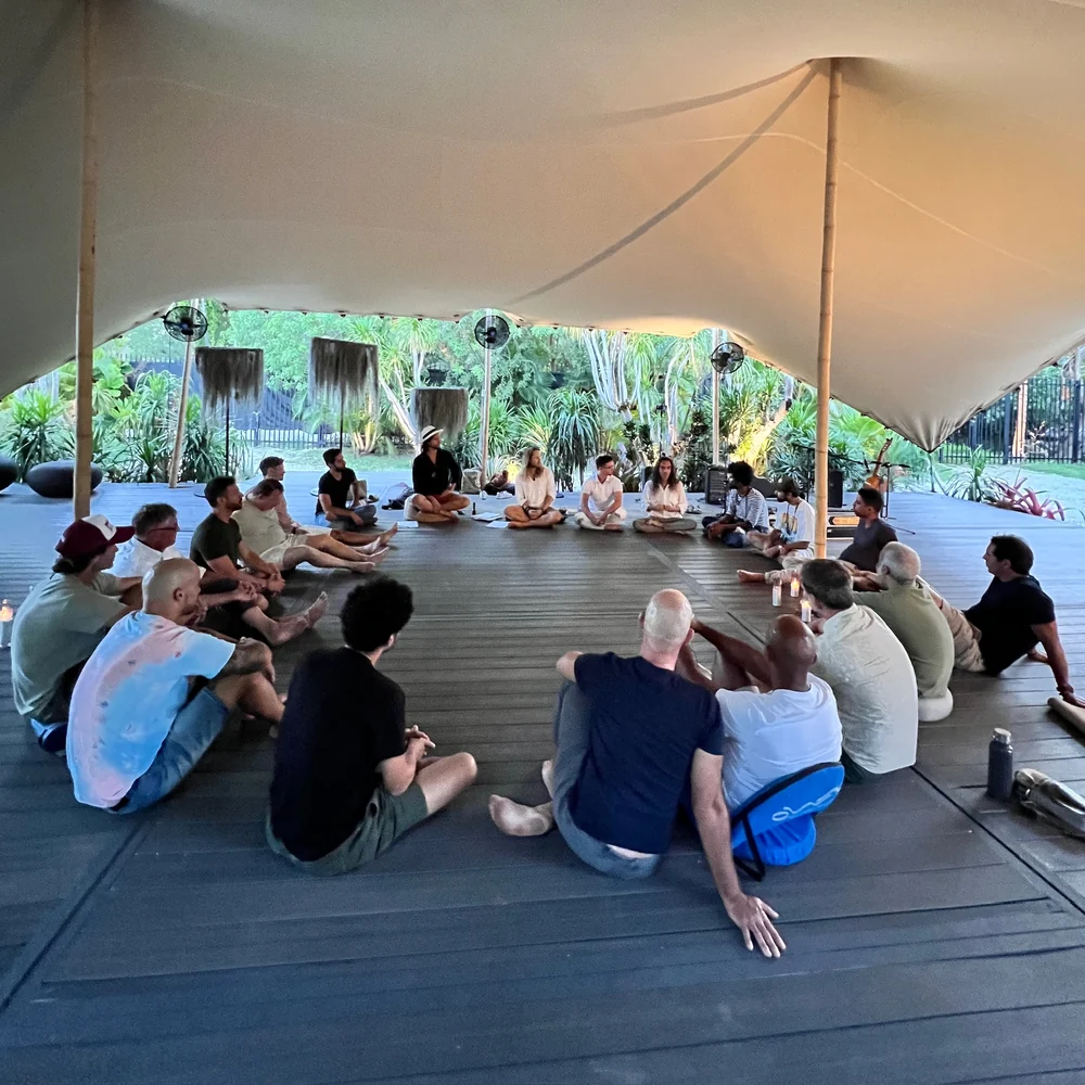 A large group seated for a men's circle